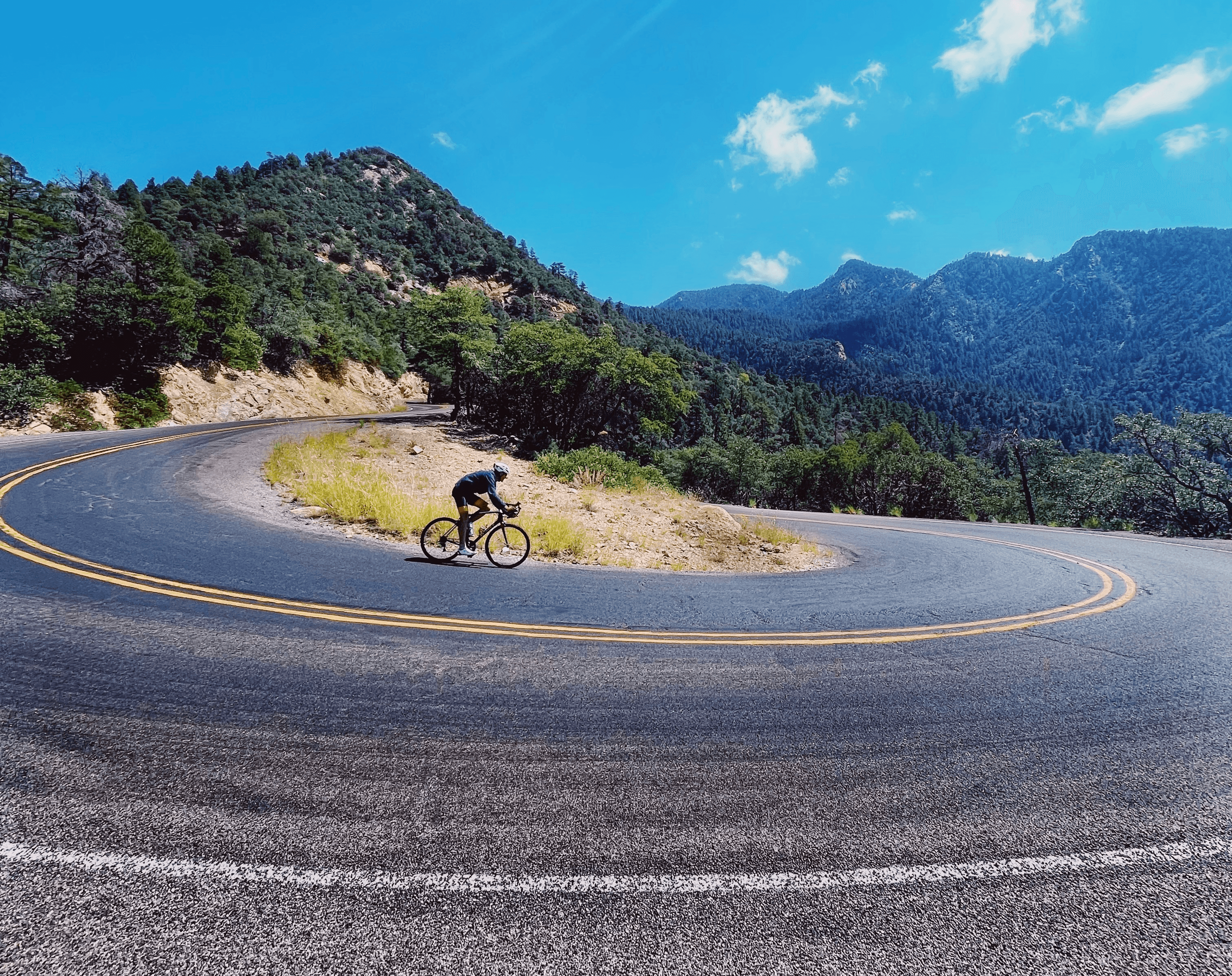 rider descending Mount Graham after completing the race